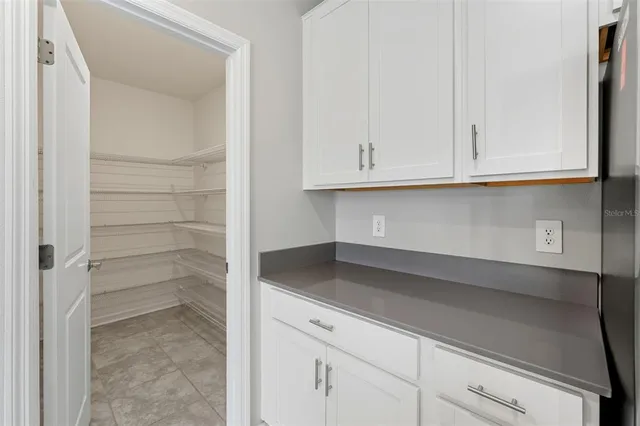 a view of storage and utility room with cabinet
