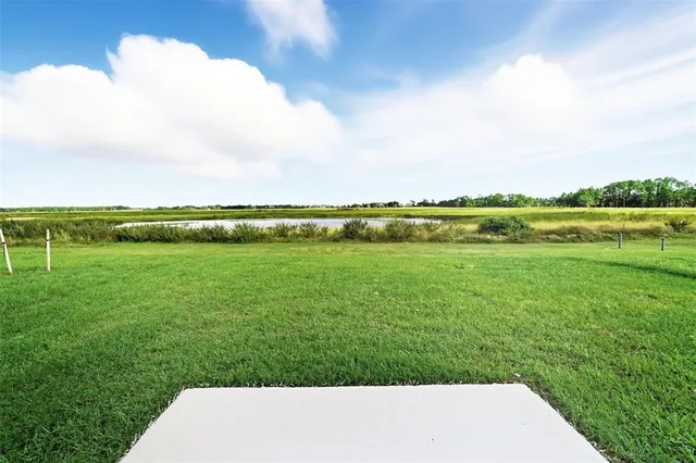 a view of a lake with a big yard