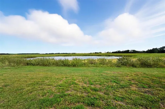 a view of a yard in front of a house