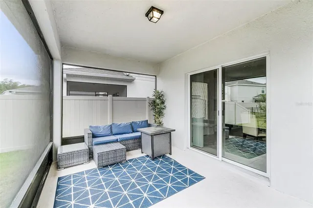 a living room with furniture and a rug