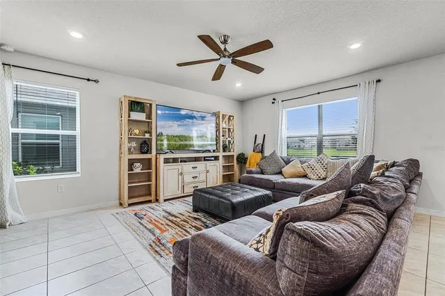 a living room with furniture and windows