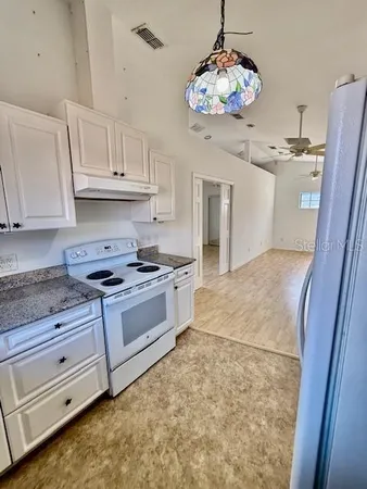 a bathroom with a sink a mirror and a shower