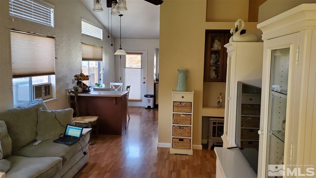 7652 Devonshire Lane Reno, NV 89511 - Photo 4 of 17 a living room with furniture and a wooden floor
