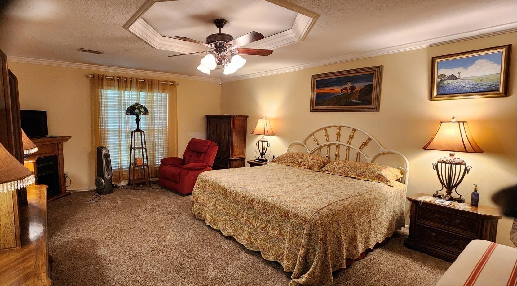 16155 Hexham Drive Spring, TX 77379 - Photo 24 of 47 a spacious bedroom with a bed and lamp