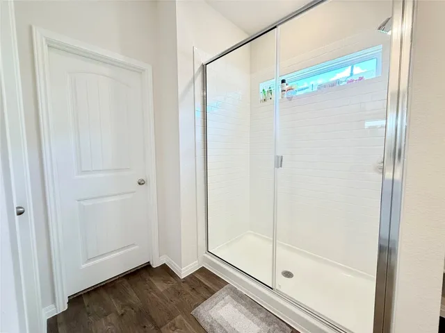 a room with a bed and a window