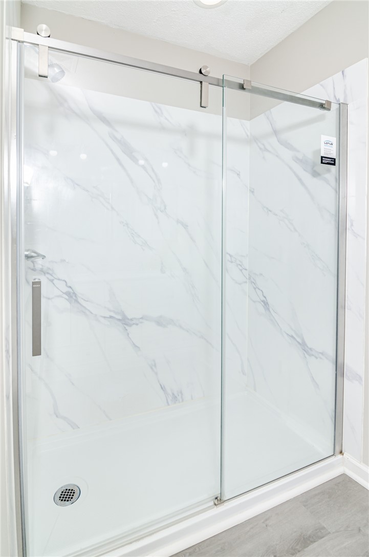 102 Hawk Ridge Drive Anderson, SC 29621 - Photo 8 of 38 This modern shower with a sliding glass door offers a refreshing bathing experience.