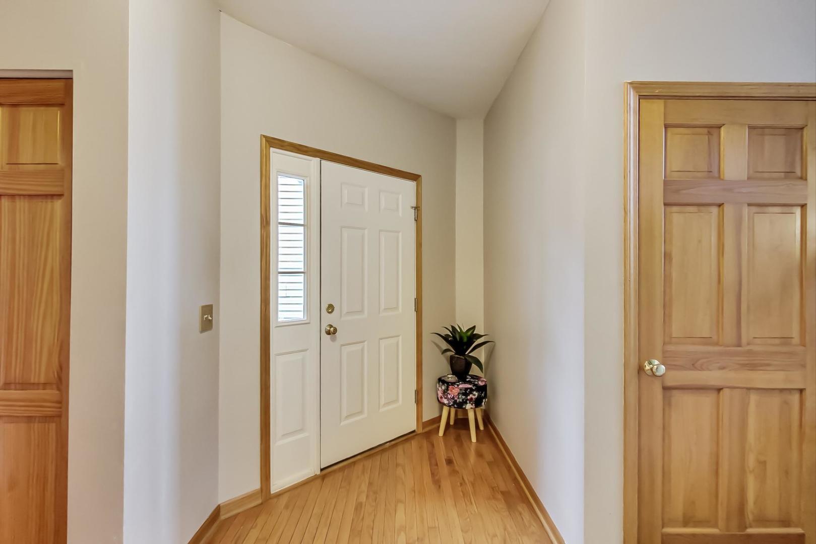 345 Ridge Road North Aurora, IL 60542 - Photo 3 of 38 a view of front door with wooden floor