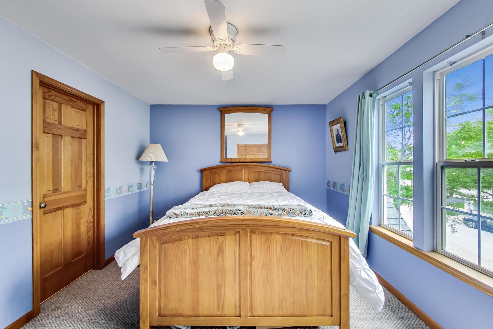 345 Ridge Road North Aurora, IL 60542 - Photo 22 of 38 a bedroom with a bed and a window