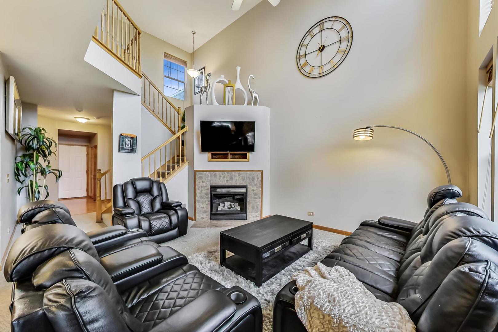 345 Ridge Road North Aurora, IL 60542 - Photo 4 of 38 a living room with furniture fireplace and flat screen tv