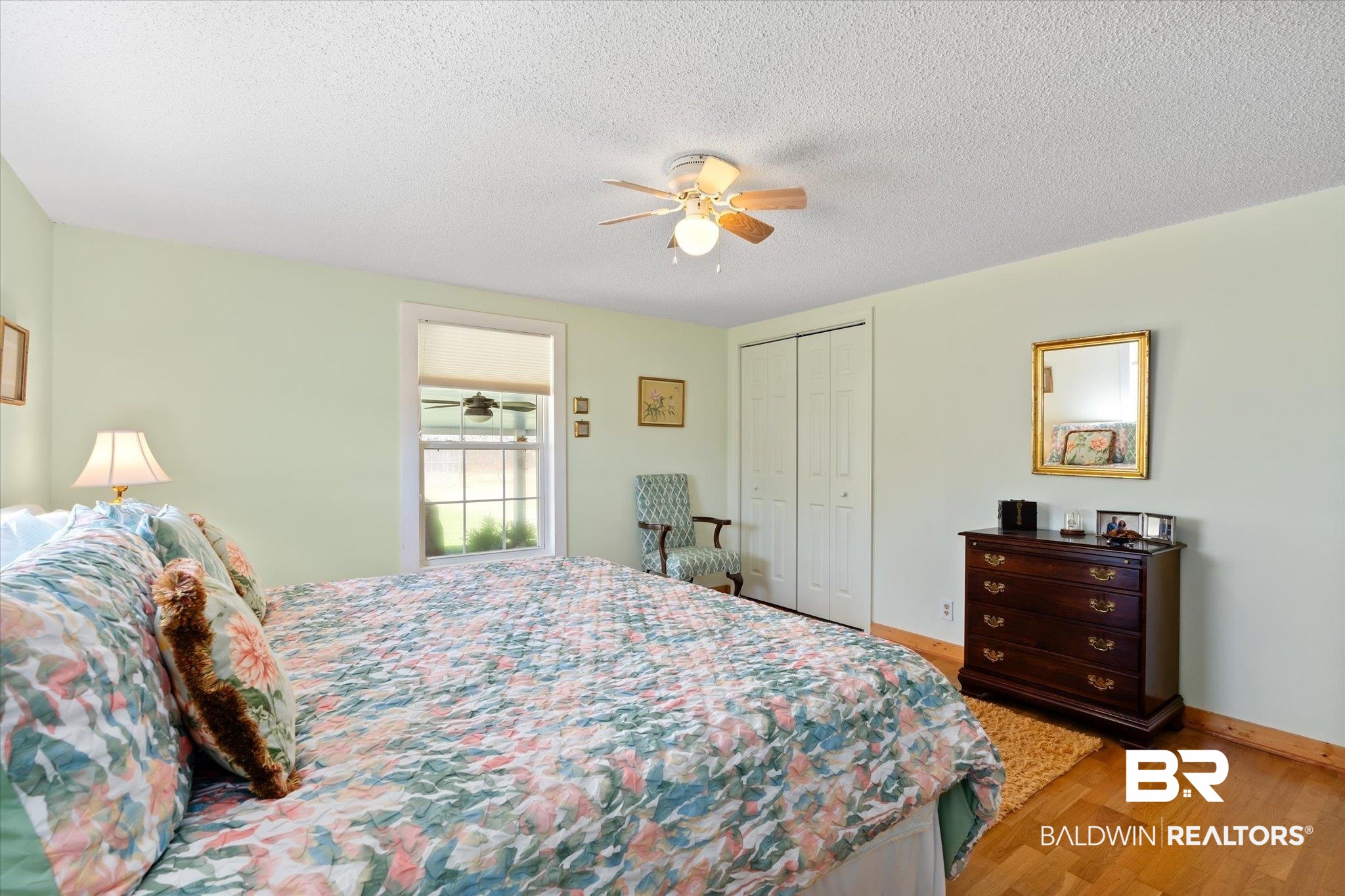 14280 Cat Deakle Road Grand Bay, AL 36541 - Photo 21 of 51 Bedroom with light wood finished floors, baseboards, ceiling fan, a textured ceiling, and a closet