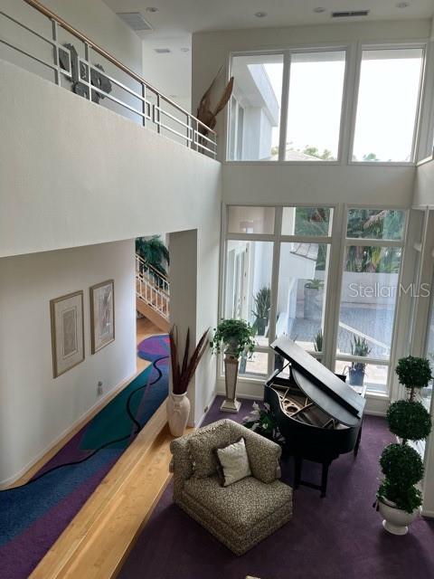 1522 Gulf Boulevard Indian Rocks Beach, FL 33785 - Photo 11 of 52 a living room with furniture fireplace and wooden floor