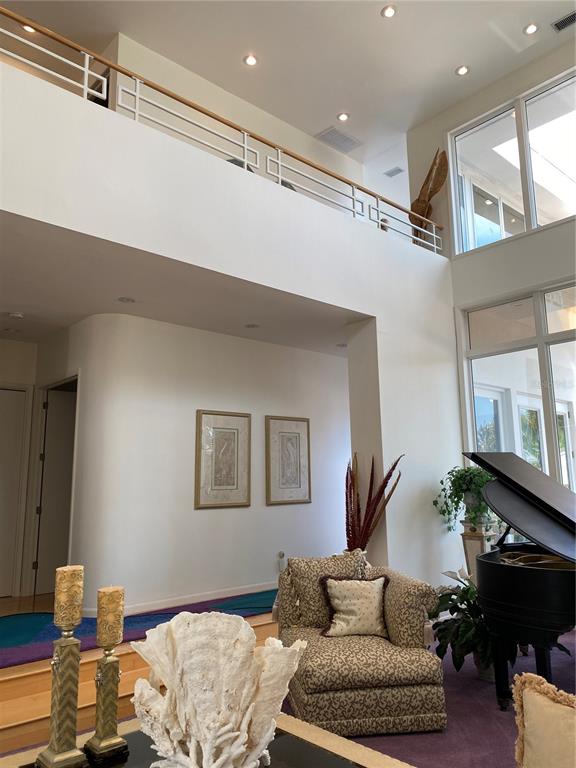 1522 Gulf Boulevard Indian Rocks Beach, FL 33785 - Photo 12 of 52 a living room with furniture and a wooden floor