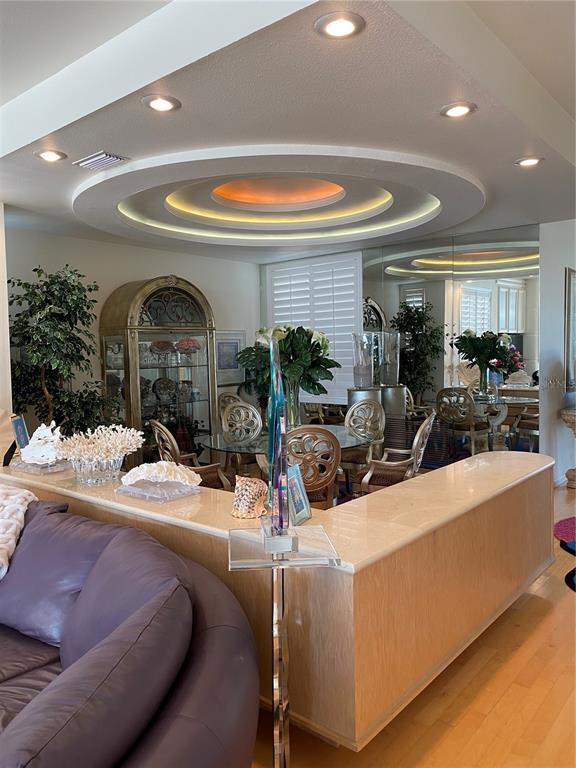 1522 Gulf Boulevard Indian Rocks Beach, FL 33785 - Photo 16 of 52 a view of living room with granite countertop a couch and chairs