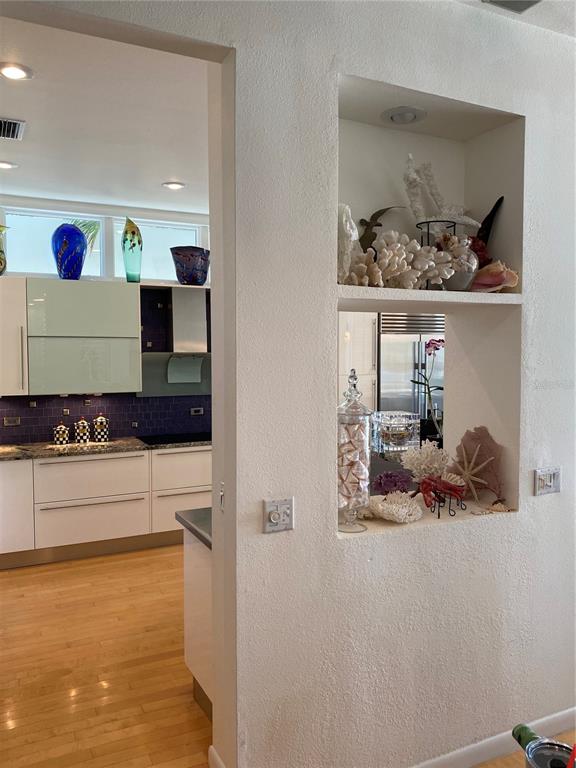 1522 Gulf Boulevard Indian Rocks Beach, FL 33785 - Photo 17 of 52 a bathroom with a sink and a mirror