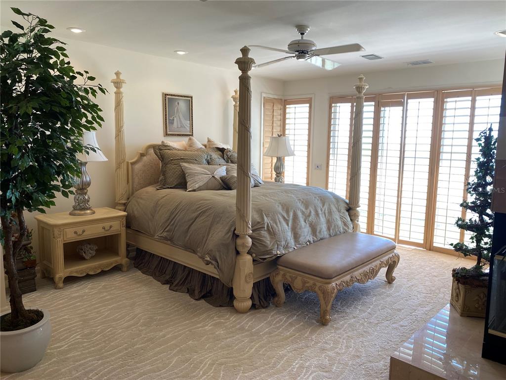 1522 Gulf Boulevard Indian Rocks Beach, FL 33785 - Photo 32 of 52 a bedroom with a bed and a couch