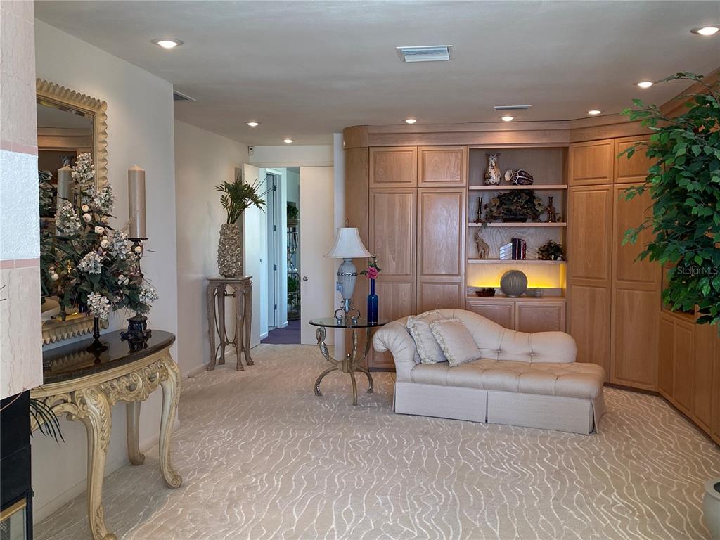 1522 Gulf Boulevard Indian Rocks Beach, FL 33785 - Photo 33 of 52 a living room with furniture and a potted plant