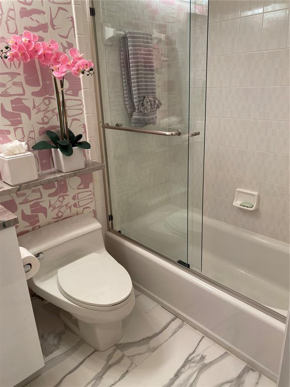 1522 Gulf Boulevard Indian Rocks Beach, FL 33785 - Photo 44 of 52 a bathroom with a toilet and a shower