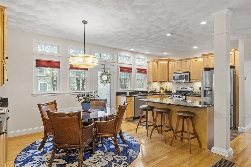 820 Main Street, Unit 1 Wakefield, MA 01880 - Photo 13 of 36 a view of a dining room with furniture window and wooden floor