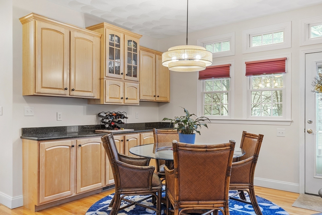 820 Main Street, Unit 1 Wakefield, MA 01880 - Photo 14 of 36 a view of a dining room with furniture window and wooden floor