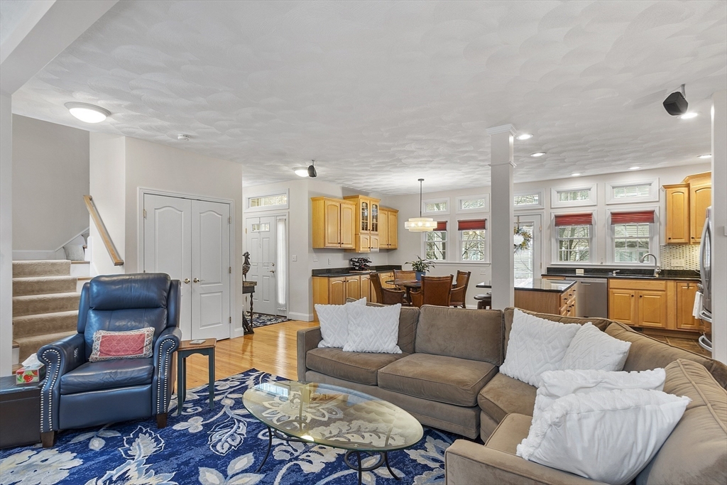 820 Main Street, Unit 1 Wakefield, MA 01880 - Photo 20 of 36 a living room with furniture kitchen view and a table