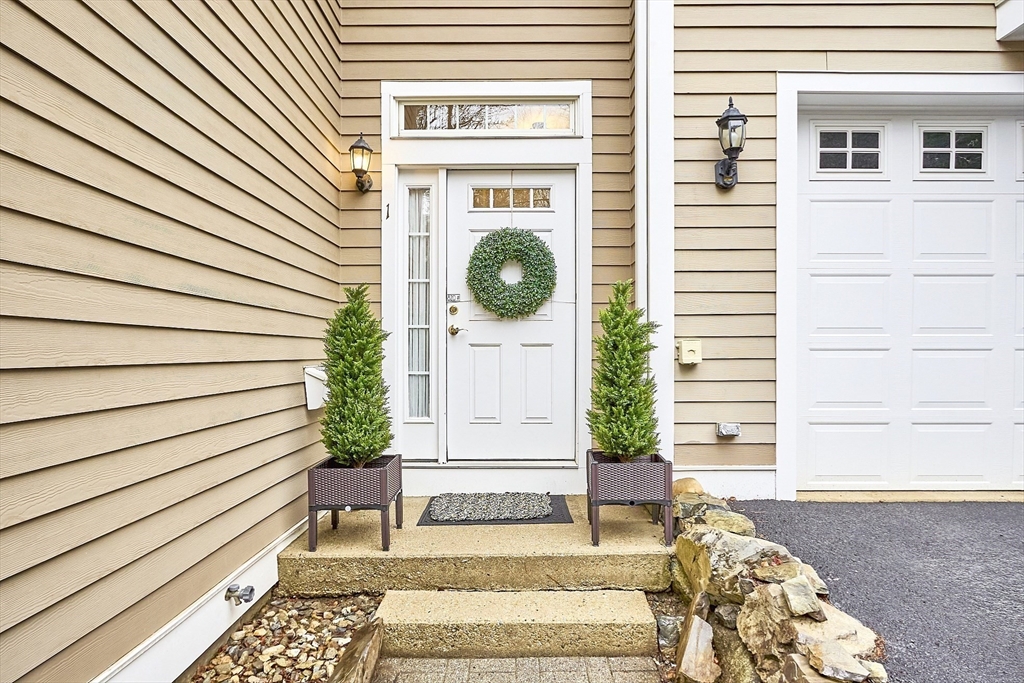 820 Main Street, Unit 1 Wakefield, MA 01880 - Photo 2 of 36 a front view of a house with garden