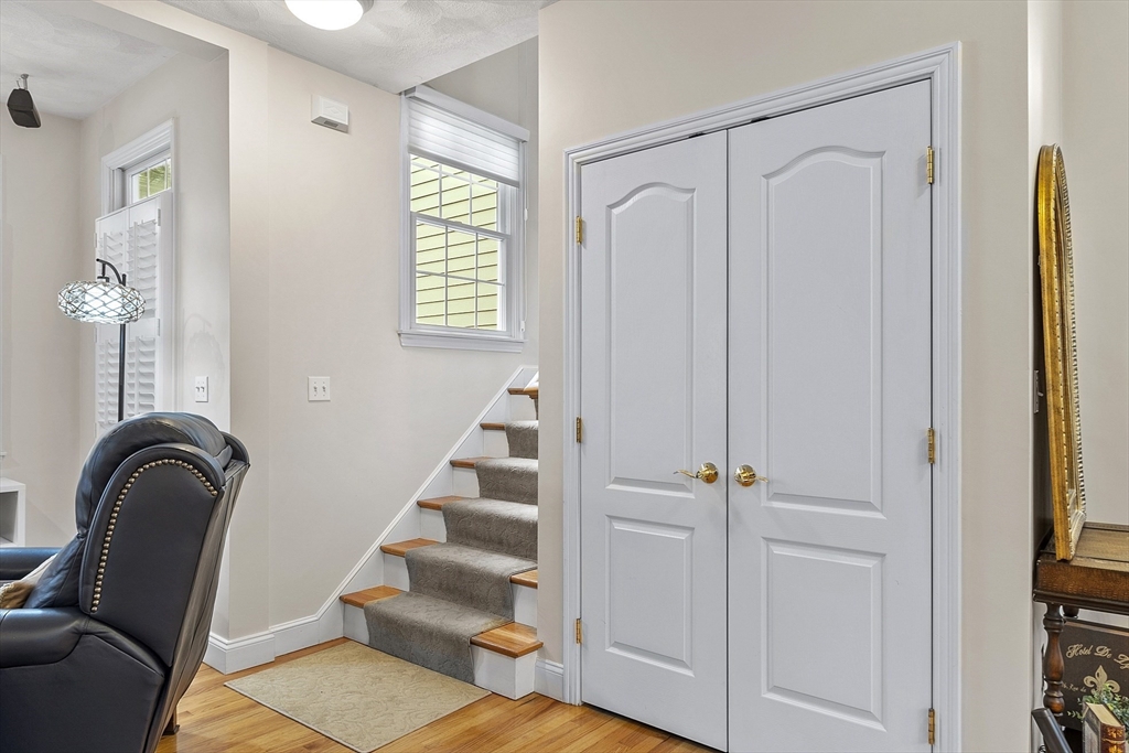 820 Main Street, Unit 1 Wakefield, MA 01880 - Photo 24 of 36 a view of a bedroom with furniture and entryway