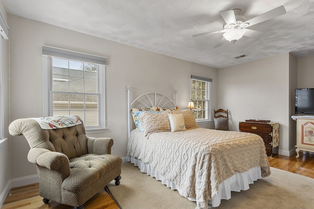 820 Main Street, Unit 1 Wakefield, MA 01880 - Photo 27 of 36 a bedroom with bed and a window