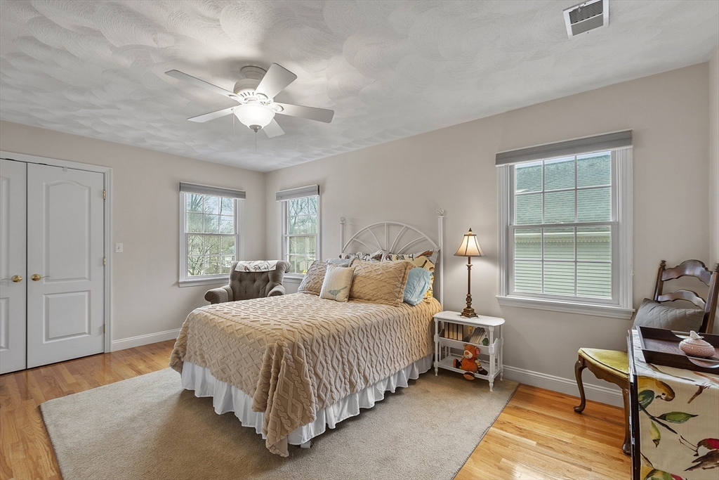 820 Main Street, Unit 1 Wakefield, MA 01880 - Photo 29 of 36 a bedroom with a bed and window