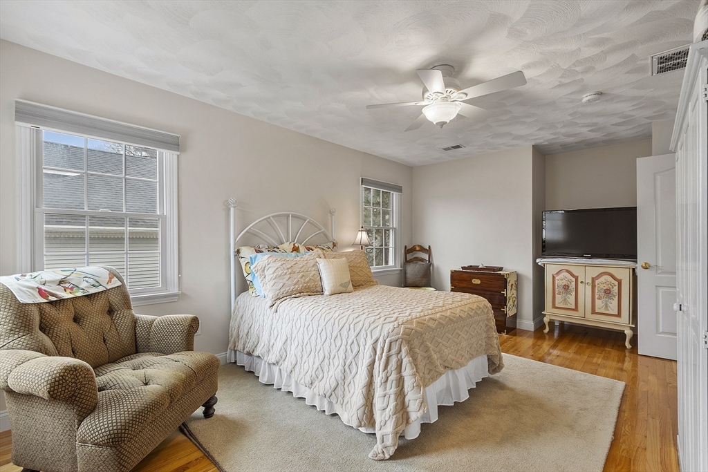 820 Main Street, Unit 1 Wakefield, MA 01880 - Photo 30 of 36 a bedroom with bed and a flat screen tv