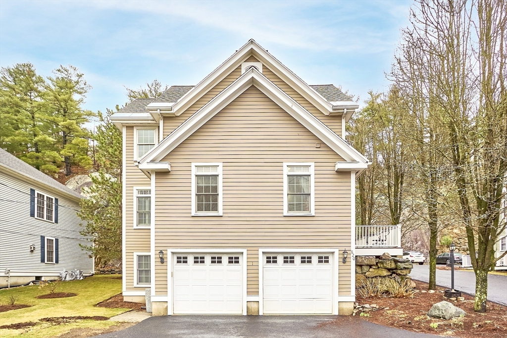 820 Main Street, Unit 1 Wakefield, MA 01880 - Photo 3 of 36 a view of a house with a street