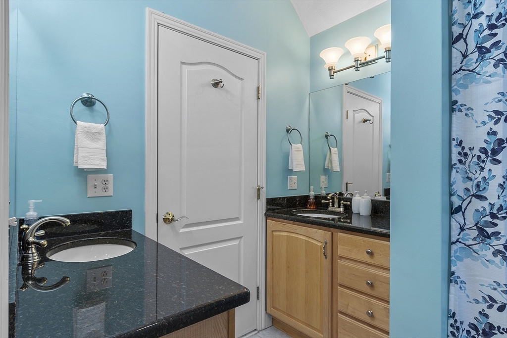 820 Main Street, Unit 1 Wakefield, MA 01880 - Photo 32 of 36 a bathroom with a sink and a mirror