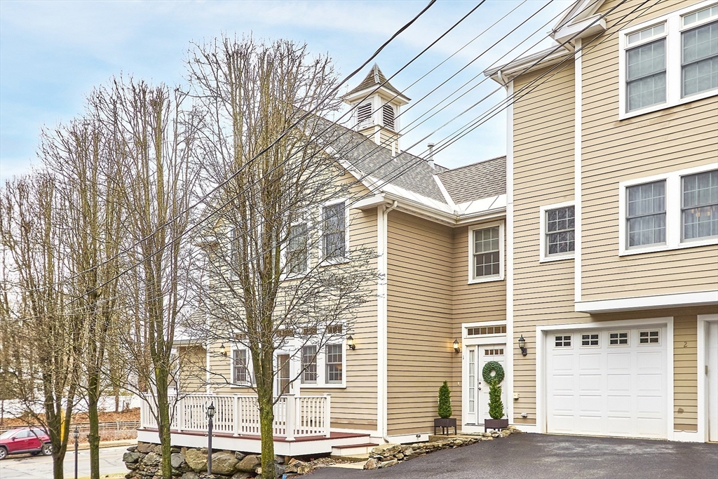820 Main Street, Unit 1 Wakefield, MA 01880 - Photo 4 of 36 a view of a house with a yard