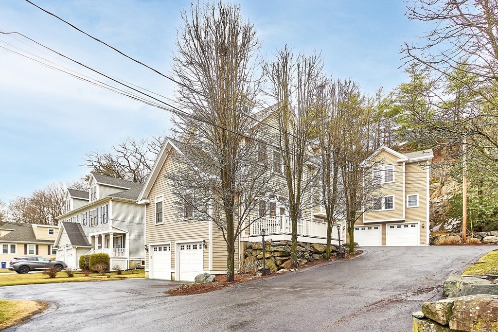 820 Main Street, Unit 1 Wakefield, MA 01880 - Photo 6 of 36 a view of a street with a building in the background
