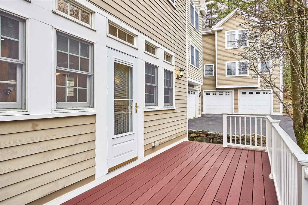 820 Main Street, Unit 1 Wakefield, MA 01880 - Photo 10 of 36 a view of a house with a deck