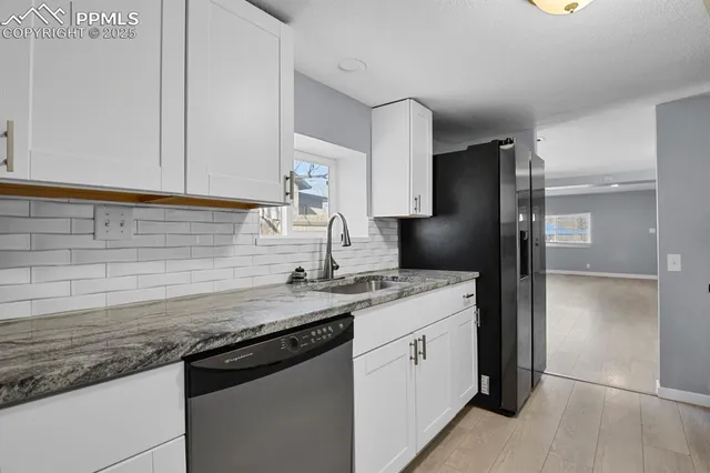 a kitchen with a sink stove and refrigerator