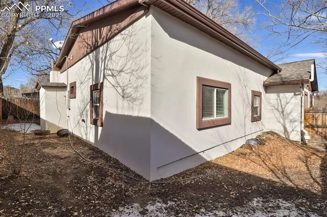 a view of a house with a snow in the yard