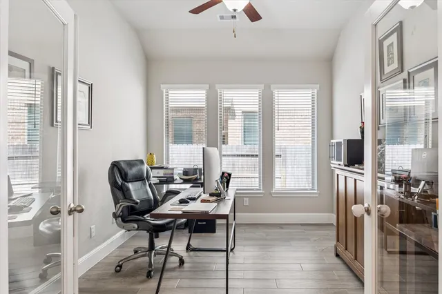 a view of a livingroom with furniture and a window
