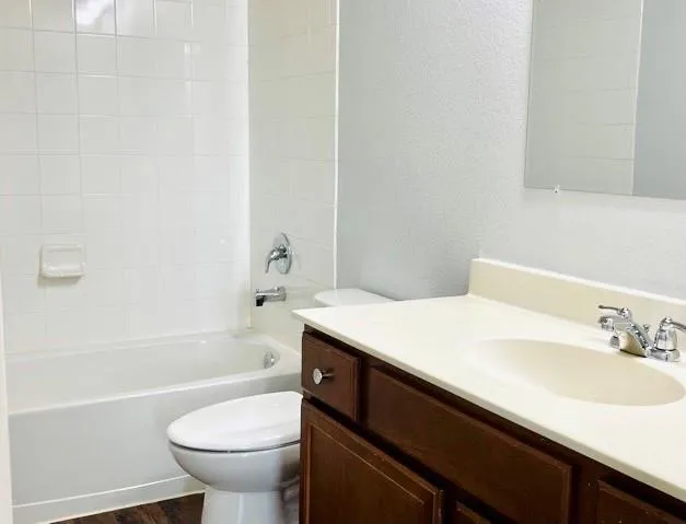 a bathroom with a sink a toilet and a bathtub