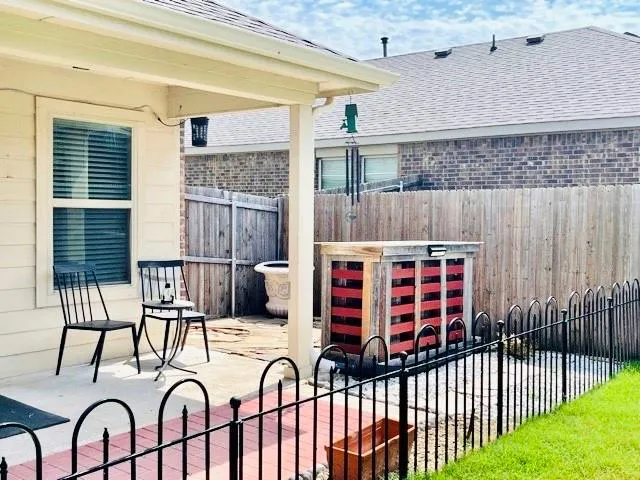 a view of a balcony with furniture