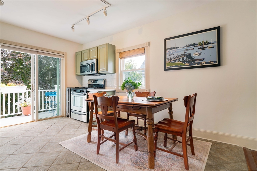 52 Victoria Street, Unit B Somerville, MA 02144 - Photo 13 of 32 a view of a dining room with furniture window and outside view