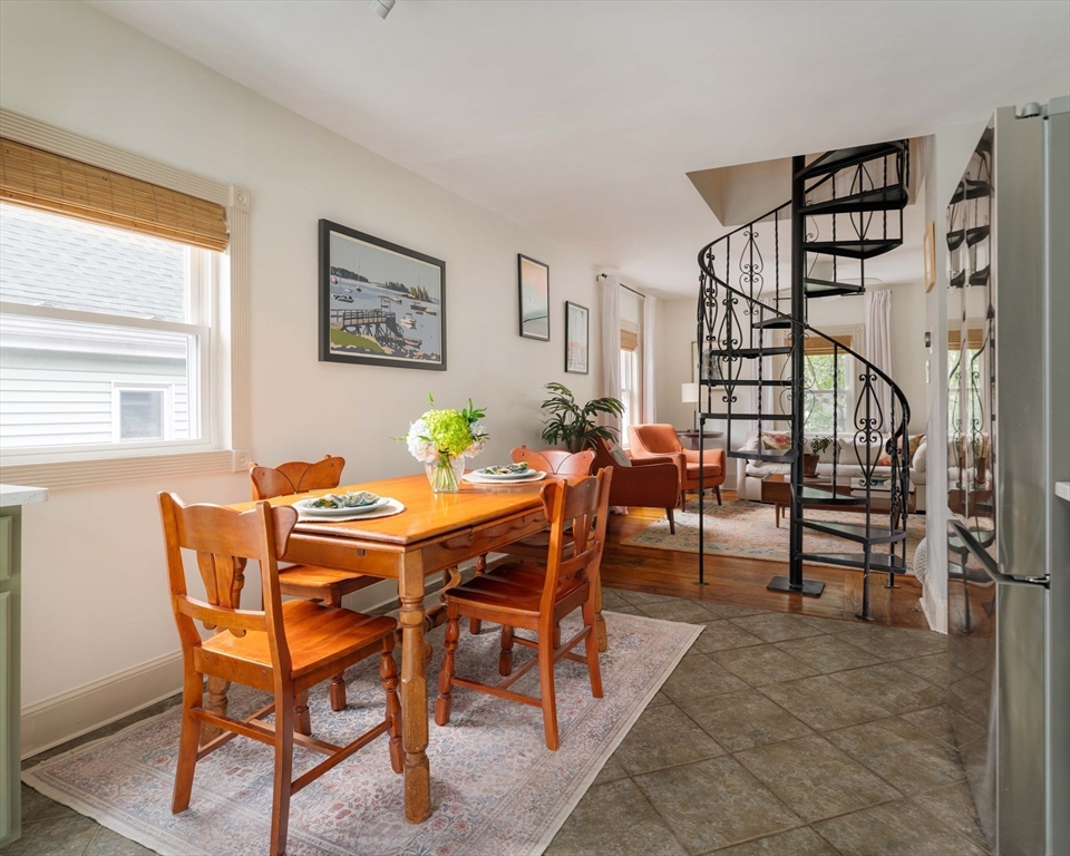 52 Victoria Street, Unit B Somerville, MA 02144 - Photo 15 of 32 a dining room with furniture and wooden floor