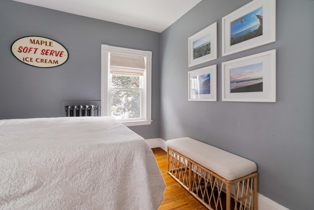 52 Victoria Street, Unit B Somerville, MA 02144 - Photo 20 of 32 a bedroom with a bed and a window