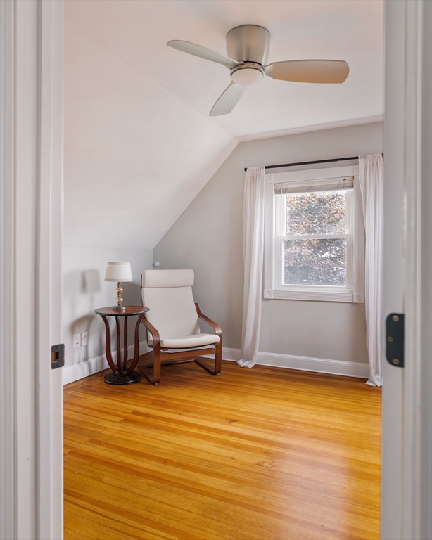 52 Victoria Street, Unit B Somerville, MA 02144 - Photo 26 of 32 a bedroom with a bed and wooden floor