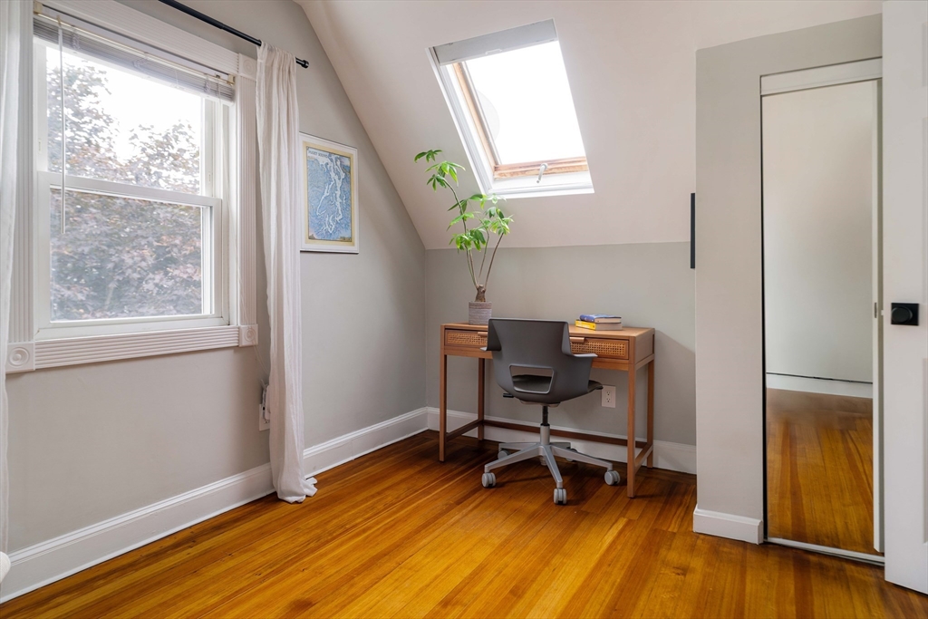 52 Victoria Street, Unit B Somerville, MA 02144 - Photo 27 of 32 a view of a workspace with furniture and a window