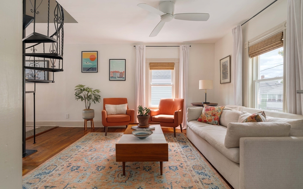 52 Victoria Street, Unit B Somerville, MA 02144 - Photo 4 of 32 a living room with furniture and a large window