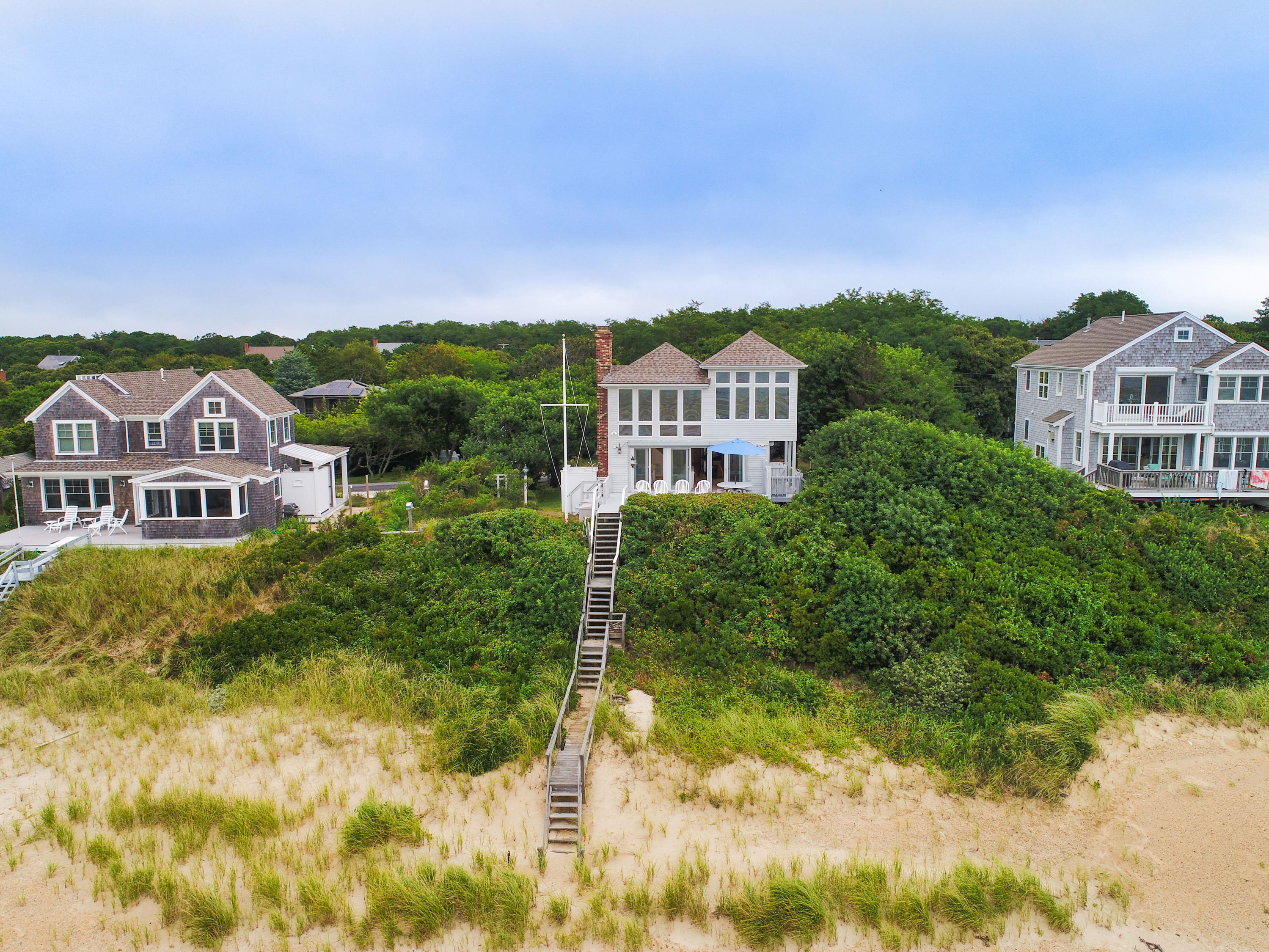 29 Bayberry Lane Eastham, MA 02642 - Photo 12 of 35 a view of a big house with a big yard and large trees