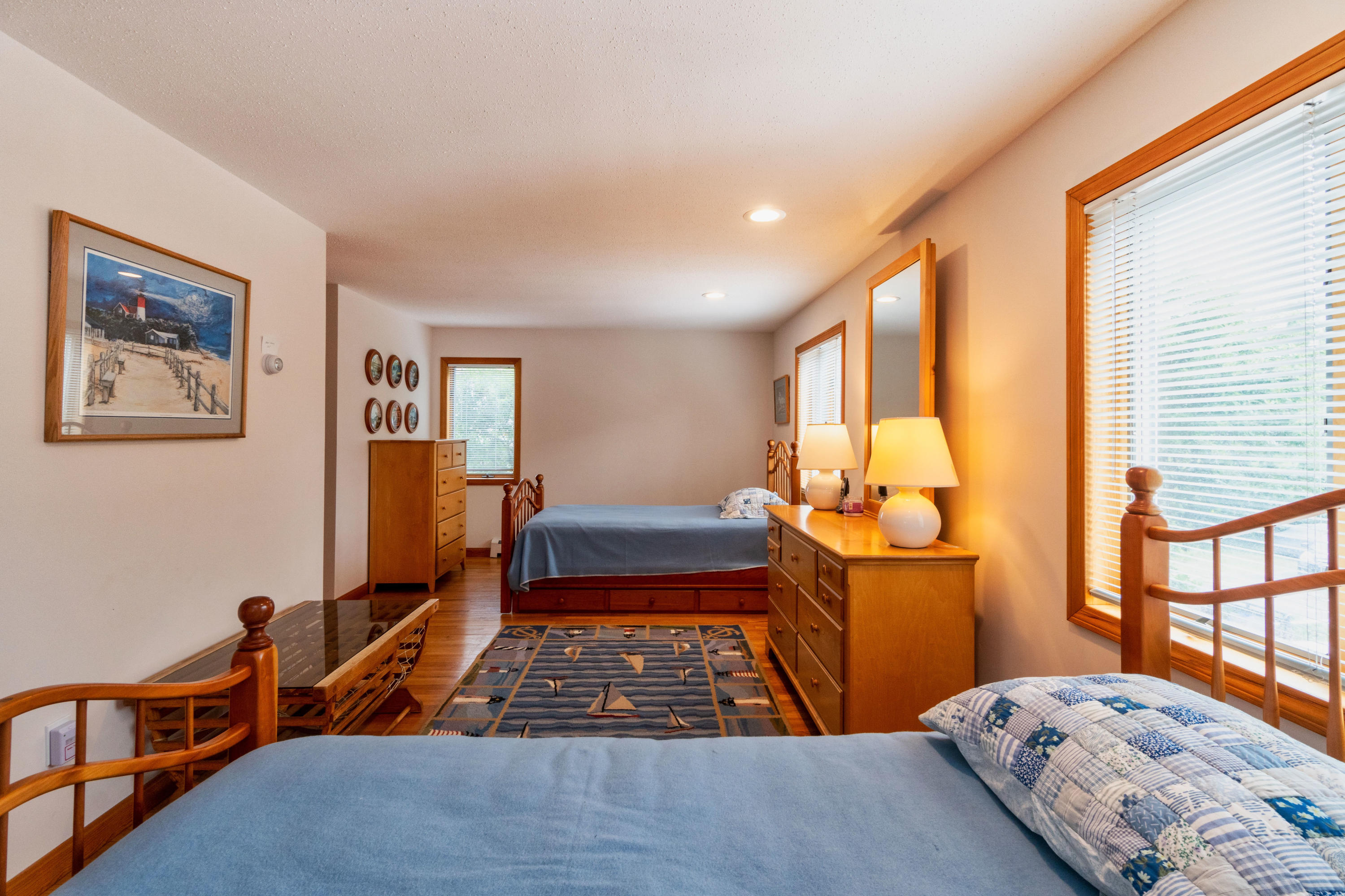 29 Bayberry Lane Eastham, MA 02642 - Photo 22 of 35 a bedroom with a bed and wooden floor