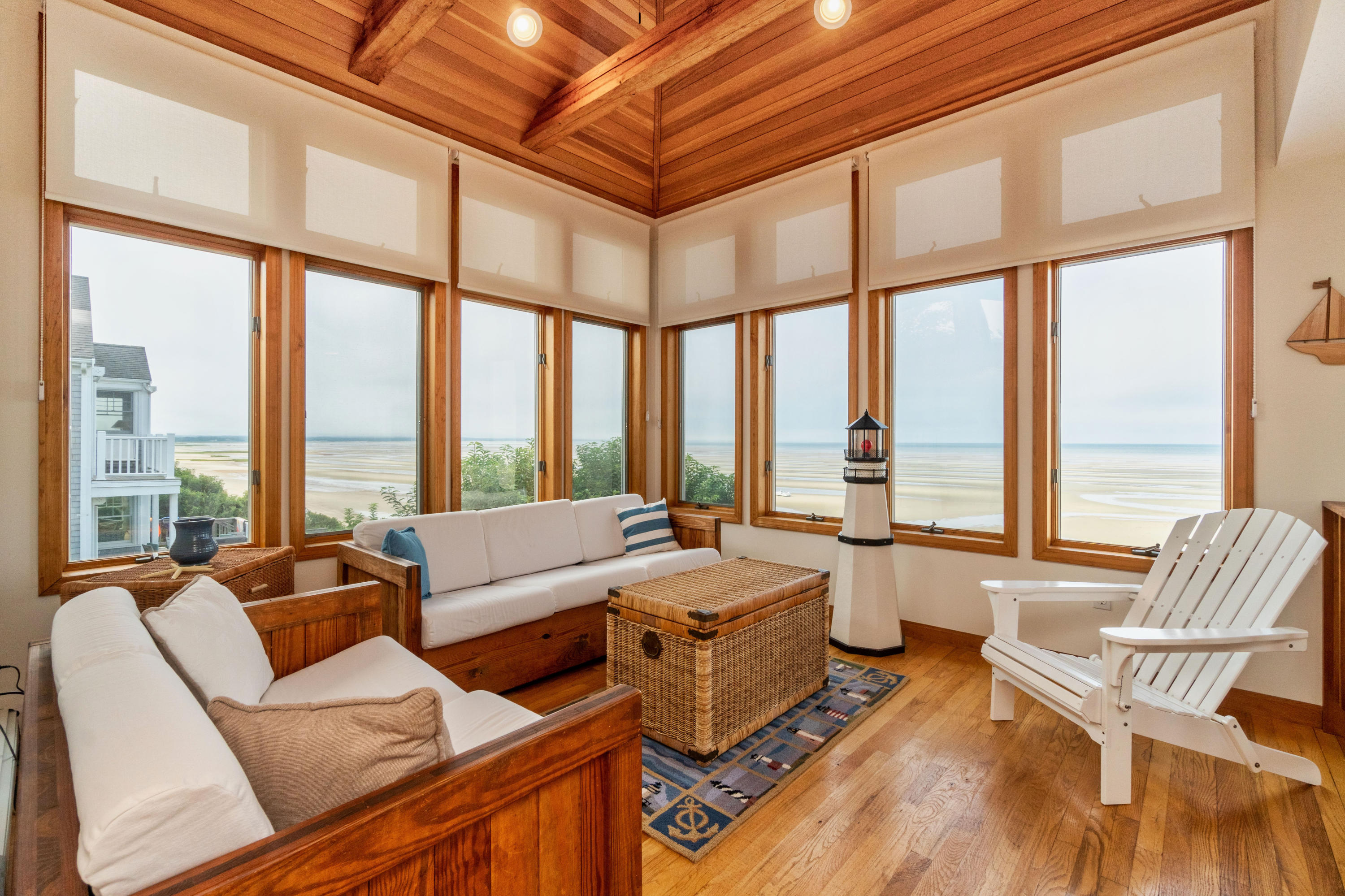 29 Bayberry Lane Eastham, MA 02642 - Photo 27 of 35 a living room with furniture and floor to ceiling windows