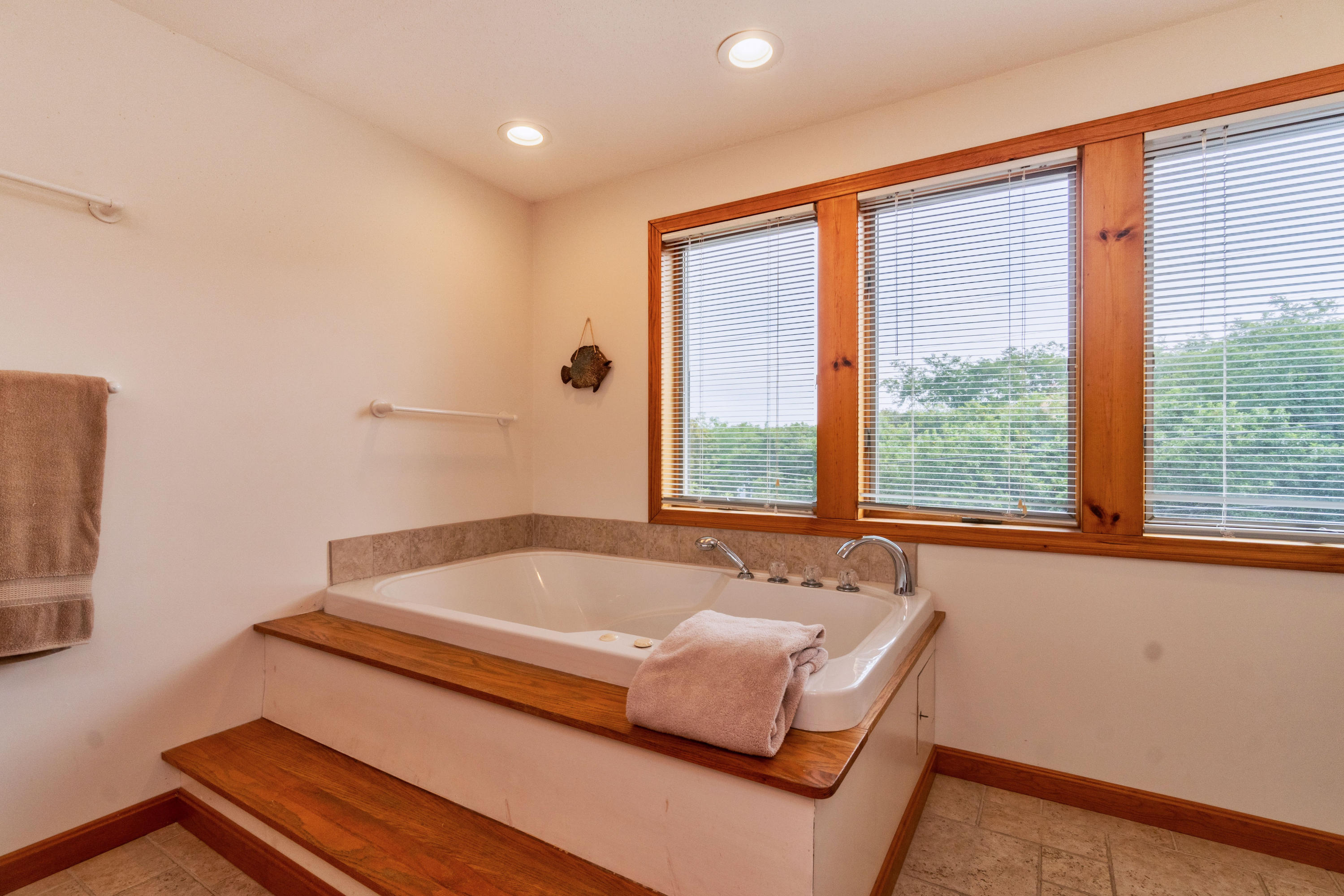 29 Bayberry Lane Eastham, MA 02642 - Photo 30 of 35 a bath tub sitting in a bathroom next to a window