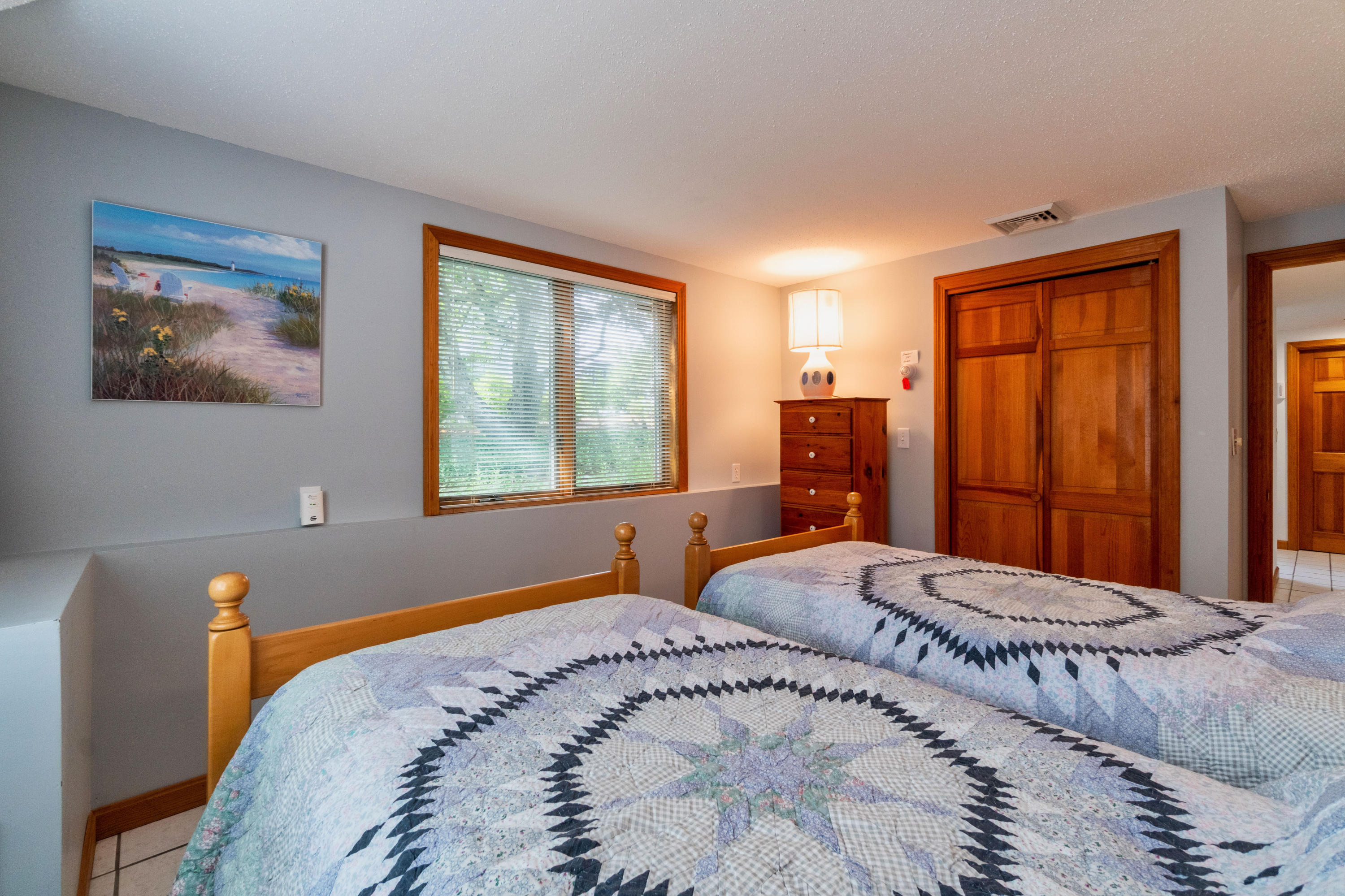 29 Bayberry Lane Eastham, MA 02642 - Photo 32 of 35 a bedroom with a large bed and a window